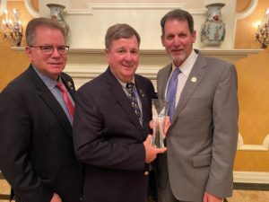 Dr. David Perkins (center) received the 2020 Guy Shampaine Award. Also shown, Dr. Shampaine, pictured right, Dr. Harvey Weingarten, pictured left. 